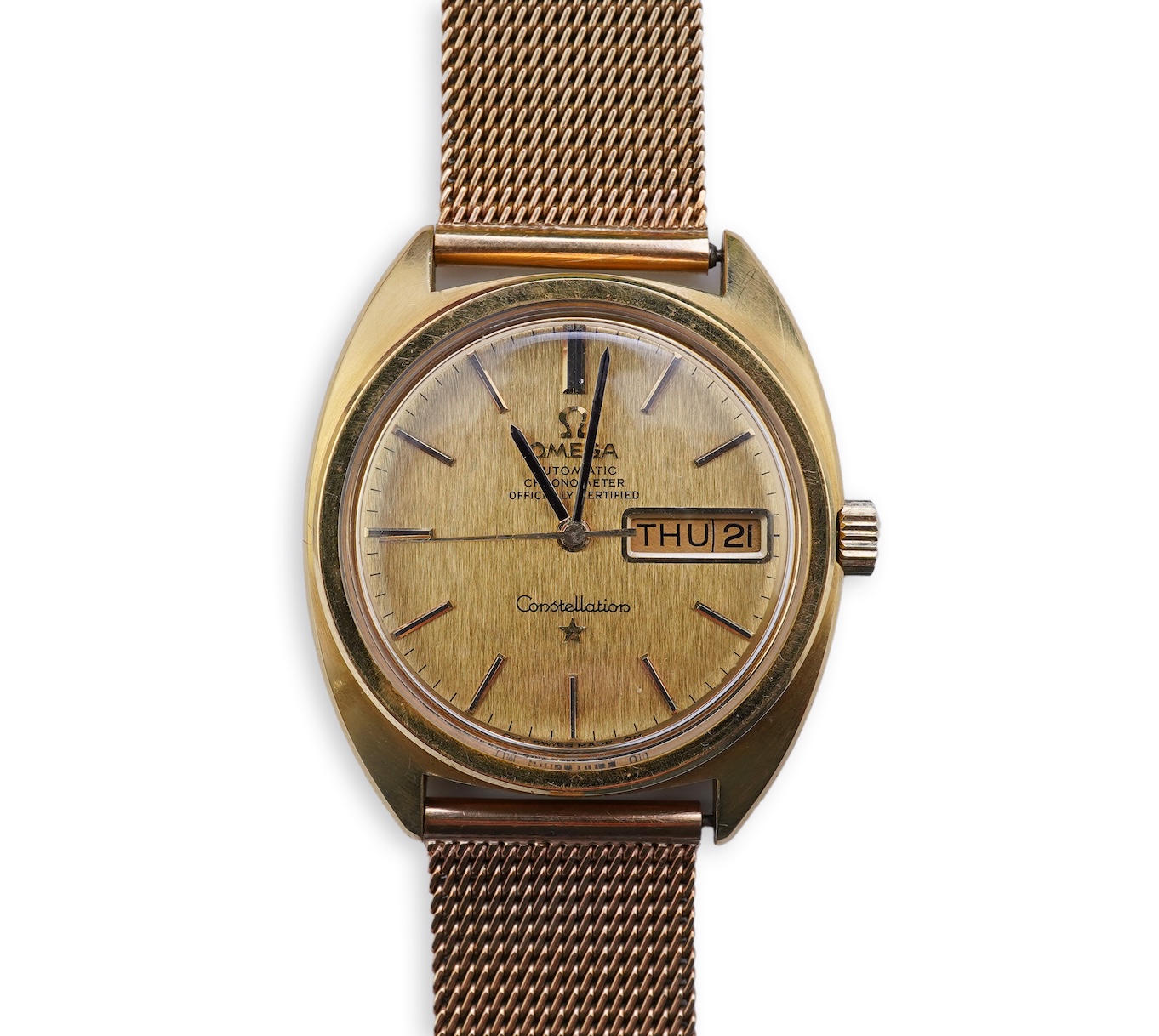 A gentleman's late 1960's 18ct gold Omega Constellation Automatic Chronometer Officially Certified wrist watch, on an associated 9ct gold mesh link bracelet